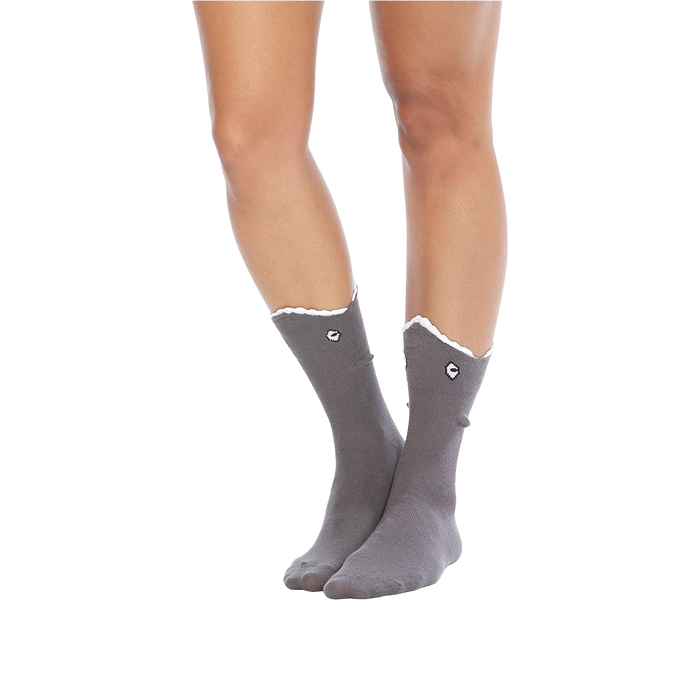 A pair of gray socks with a shark face on each sock. The shark face has a black nose and mouth and a white tooth. The socks are mid-calf length and have a scalloped edge at the top.