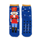 Blue crew socks featuring a Nutcracker design, snowflakes, and non-skid grips on the soles. Red, gold, and white accents.