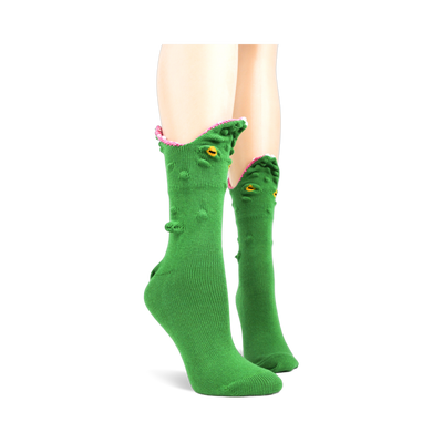 Green crew socks with a 3D alligator face design.  The alligator's mouth is playfully open, showing pink textured inside, yellow eyes are embroidered on.