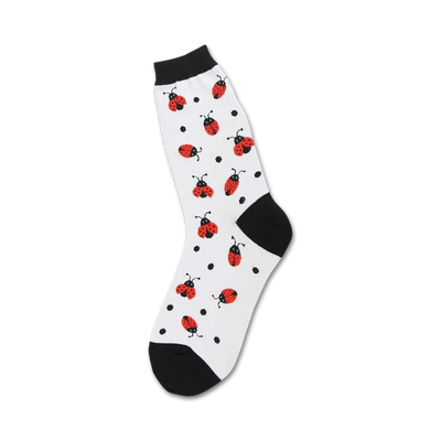  white crew length women's socks with a pattern of red ladybugs with black spots.   