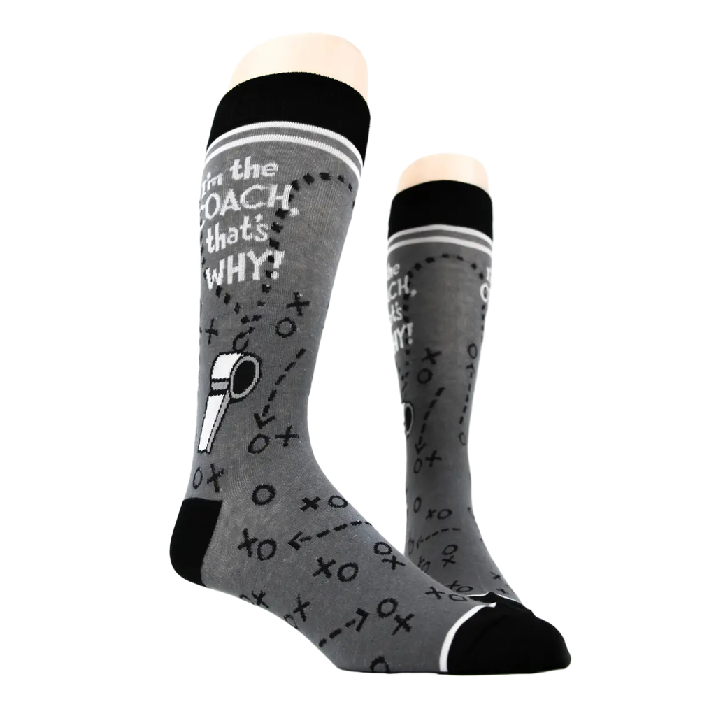 Pair of 'I'm the Coach' socks on a mannequin, showing the full design.