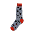 Grey crew socks featuring black ninja silhouettes and red accents.  The sock cuff has a red and black repeating star pattern.