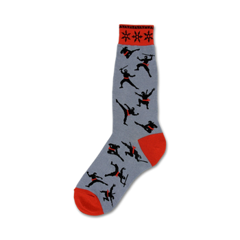 gray crew socks with a pattern of black ninjas wearing red headbands and carrying swords. red toes and heels. 