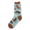 Light blue crew sock covered in brown horses, saddles, and brushes, featuring a brown toe and heel with dashed orange lines.