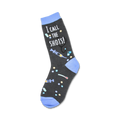 Crew socks in dark grey with light blue accents.  The design includes a syringe, stethoscope, pills, and the text 'I Call the Shots!'