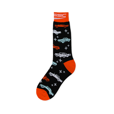 Black crew socks with vintage cars in orange, blue, and white, light grey stars, plus a bright orange cuff, heel, and toe.
