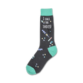 Crew socks in dark grey and teal.  The socks have a design of medical tools (syringes, pills) and the phrase 'I Call the Shots!'