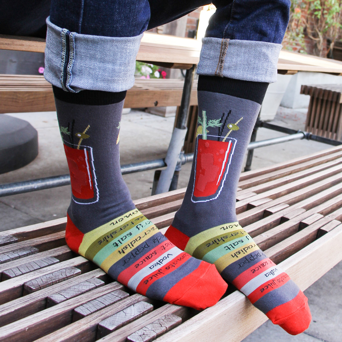 Lifestyle photo of a person wearing the Bloody Mary socks with jeans, showcasing the socks' fit and design. [lf]