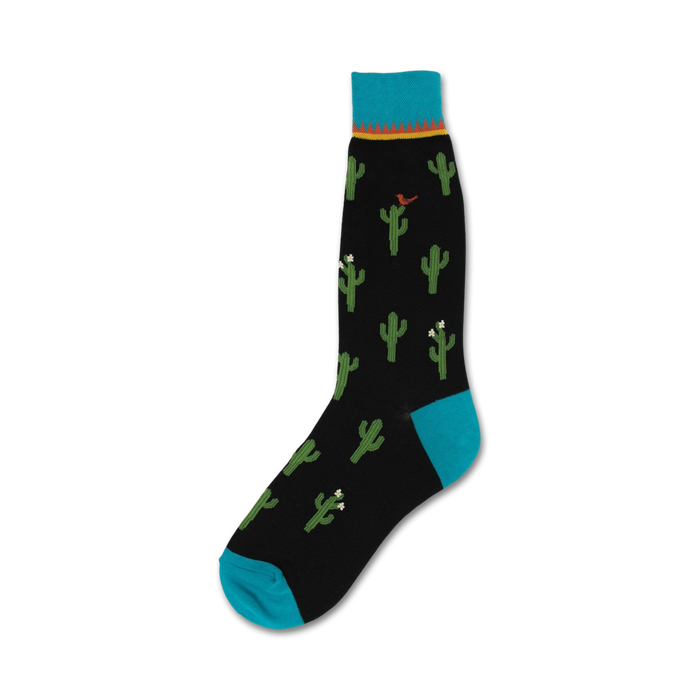 black crew socks feature emerald green cacti with white flowers and tiny red birds on a pastel blue background.   