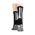 Rear view of model's legs wearing black skeleton socks with grey non-skid bottoms against a black background.