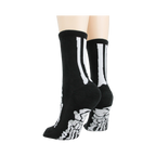 Flat lay image showcasing a pair of black skeleton socks.