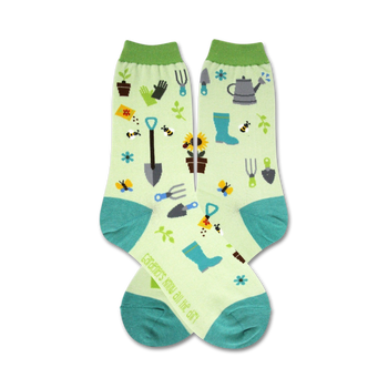 white women's crew socks with green toes and cuffs. gardening tool and flower pattern.  