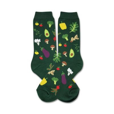 womens crew socks with a green background and food & drink pattern of vegetables such as: tomatoes, mushrooms, cauliflower, eggplant, avocado, ginger root, bell peppers, and carrots.  