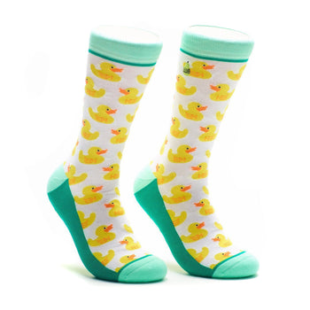 A pair of crew socks with a white background and a repeating pattern of yellow rubber duckies. Teal green accents at the top and bottom.