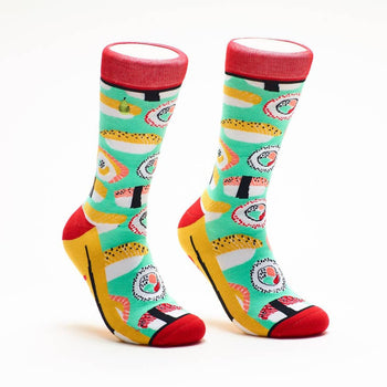 Pair of crew socks with a teal background and colorful sushi illustrations. Red, yellow, and black accents.