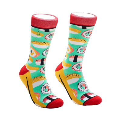 Pair of crew socks with a teal background and colorful sushi illustrations. Red, yellow, and black accents.