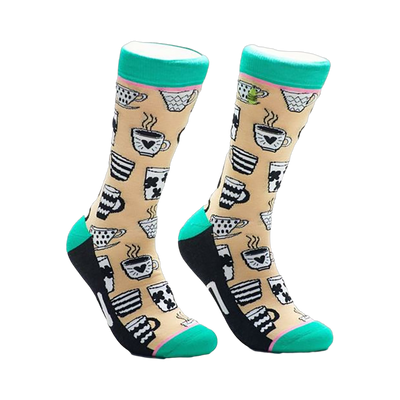 A pair of beige crew socks adorned with black and white illustrations of various coffee mugs and teacups. The socks have teal cuffs and black heels and toes.