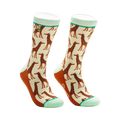Cream crew socks with a repeating pattern of brown giraffes.  Mint green and orange accents are on the cuff and heel.