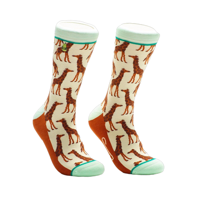 Cream crew socks with a repeating pattern of brown giraffes.  Mint green and orange accents are on the cuff and heel.
