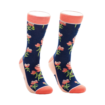 A pair of navy blue crew socks with a pattern of coral peonies and green stems. The socks have a coral-colored cuff.