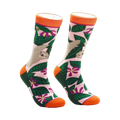 A pair of crew socks with a pink, green, and orange design.  The socks feature sloths hanging from tropical leaves and flowers.