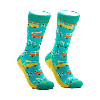 A pair of crew socks in teal, yellow, orange, and white. The design features repeating illustrations of vintage camper vans and pine trees.