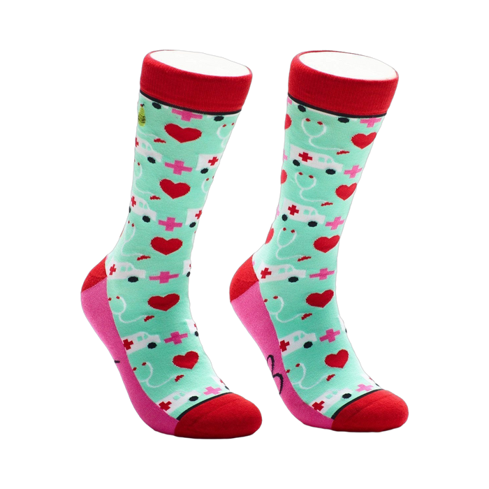 Crew socks in red, pink, and mint green.  The design features white ambulances, pink hearts, and red crosses. }}
