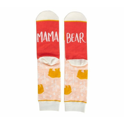 Pair of women's crew socks. Peach background with gold bear design. Red heel and toe with 'Mama Bear' text.