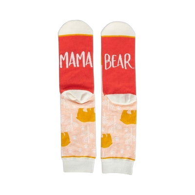 Pair of women's crew socks. Peach background with gold bear design. Red heel and toe with 'Mama Bear' text.