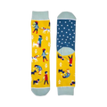 Crew socks in yellow with teal accents. Features illustrated people walking their dogs and a teal polka dot heel.