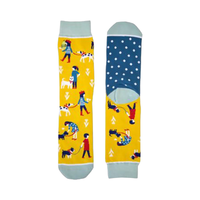 Crew socks in yellow with teal accents. Features illustrated people walking their dogs and a teal polka dot heel.