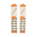Close-up shot of the socks' heels, revealing 'LOOKING' and 'SHARP' text.