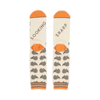 Close-up shot of the socks' heels, revealing 'LOOKING' and 'SHARP' text.