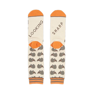 Close-up shot of the socks' heels, revealing 'LOOKING' and 'SHARP' text.