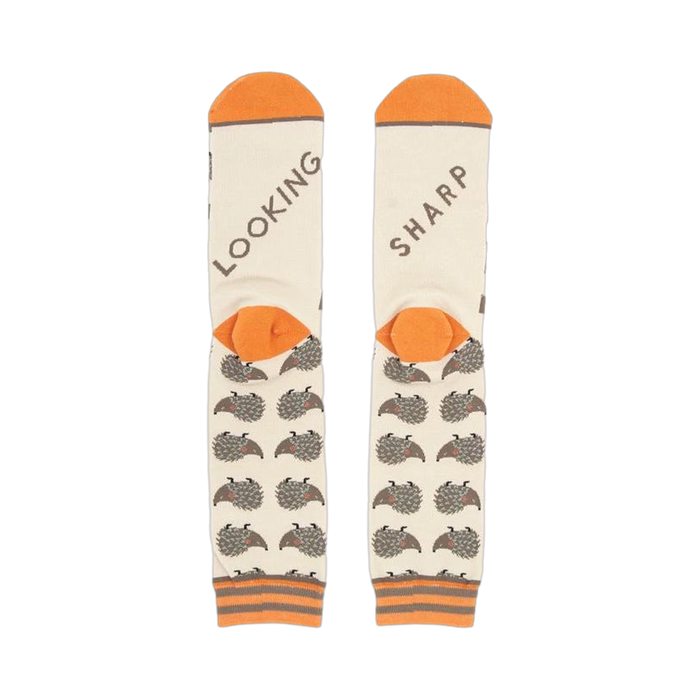 Close-up shot of the socks' heels, revealing 'LOOKING' and 'SHARP' text.