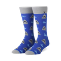 A pair of blue crew socks with a repeating pattern of grey shark faces and small, light blue boats.  The socks have grey cuffs.