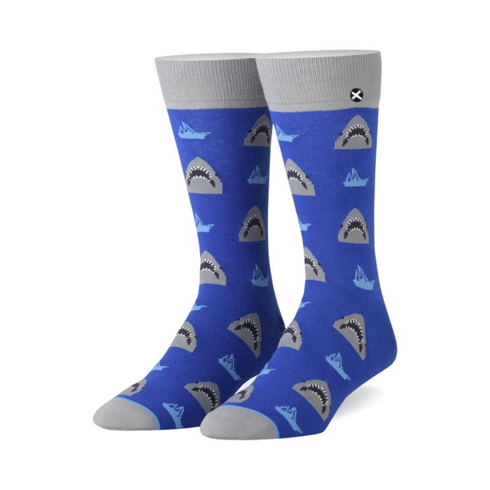 blue crew socks with a grey great white shark pattern facing different directions }}