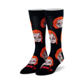 Pair of black crew socks with repeating pattern of Chucky's head featuring orange hair and stitched face. Red "CHUCKY" text on toe.