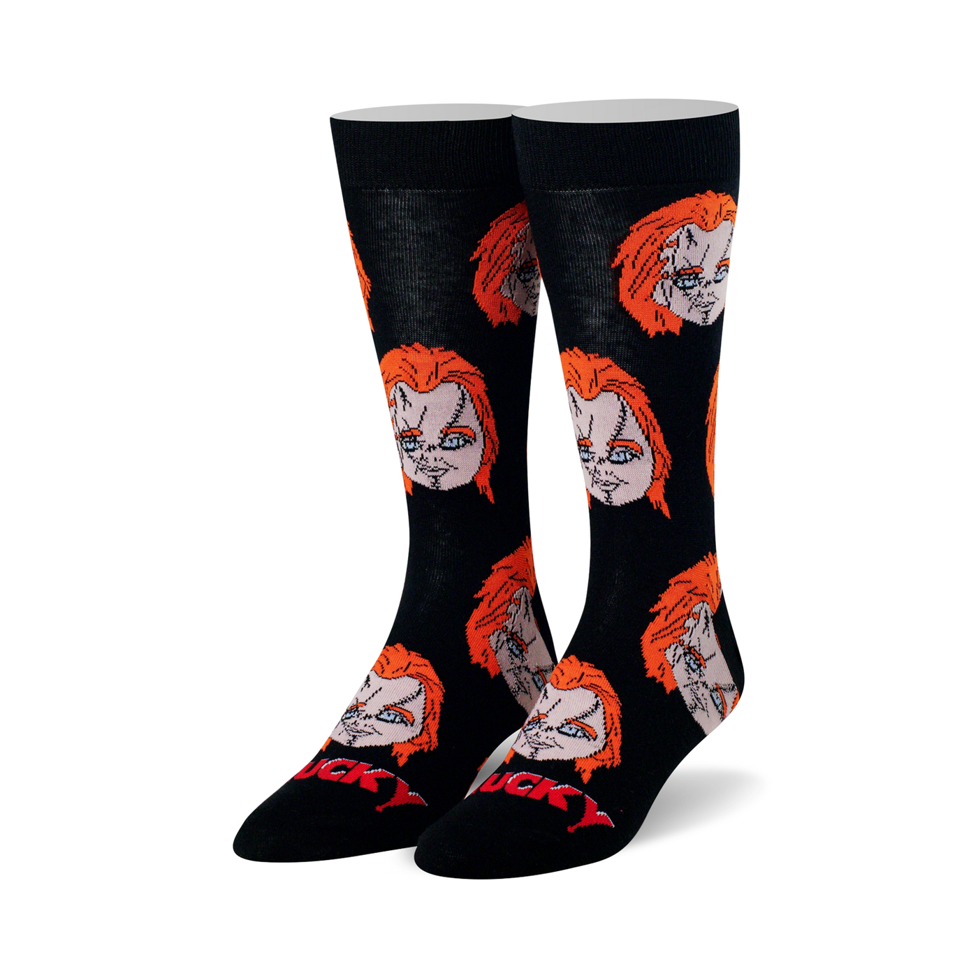 Pair of black crew socks with repeating pattern of Chucky's head featuring orange hair and stitched face. Red "CHUCKY" text on toe.