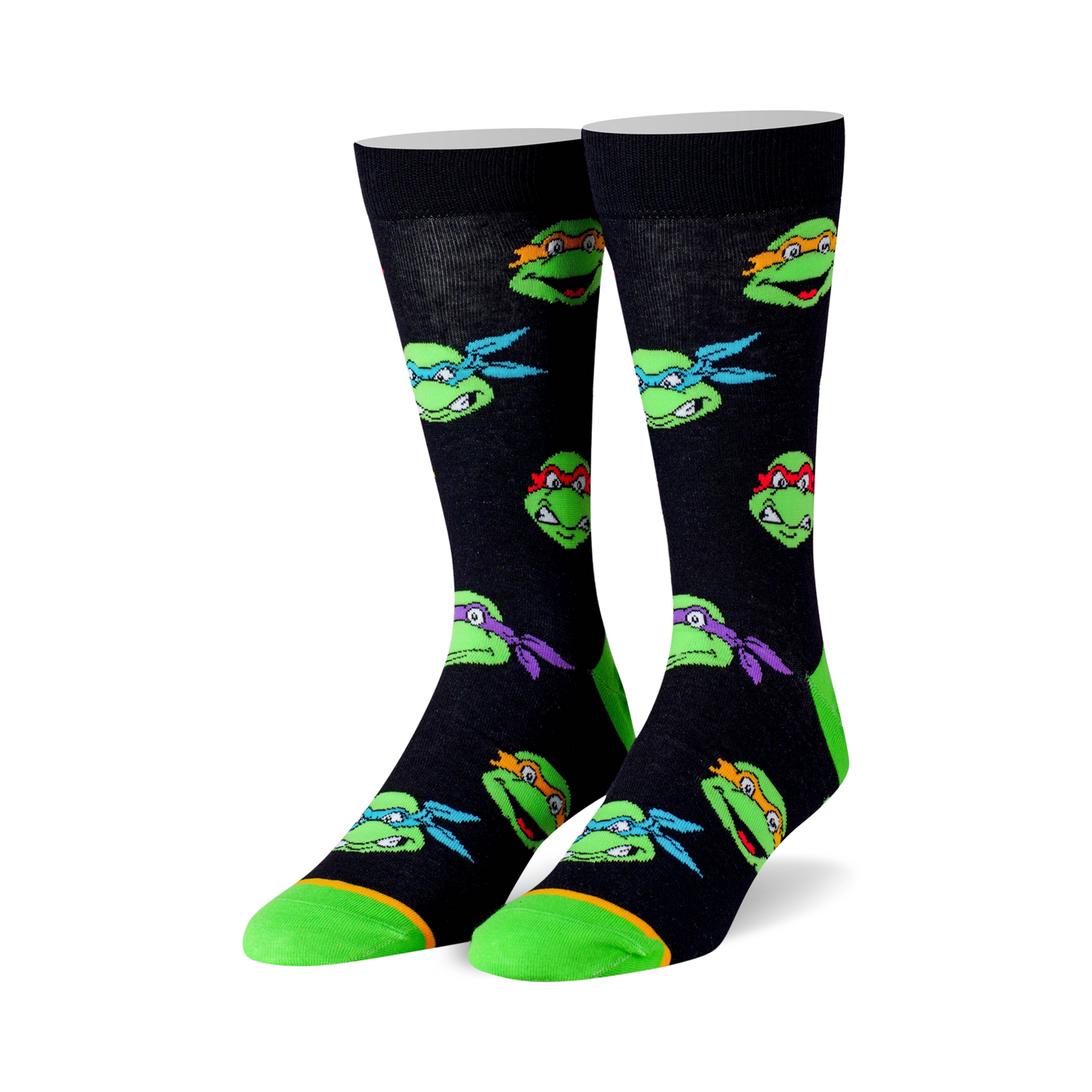 Crew socks in black with colorful Teenage Mutant Ninja Turtle head graphics. Lime green accents on the toes and heels.