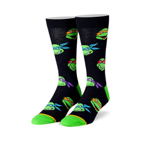 black crew socks with a repeating pattern of teenage mutant ninja turtles heads in various colors.  