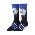 Pair of crew socks showcasing ET and Elliot silhouetted against a full moon on a dark blue background. Blue, black, and white stripes near the cuff.
