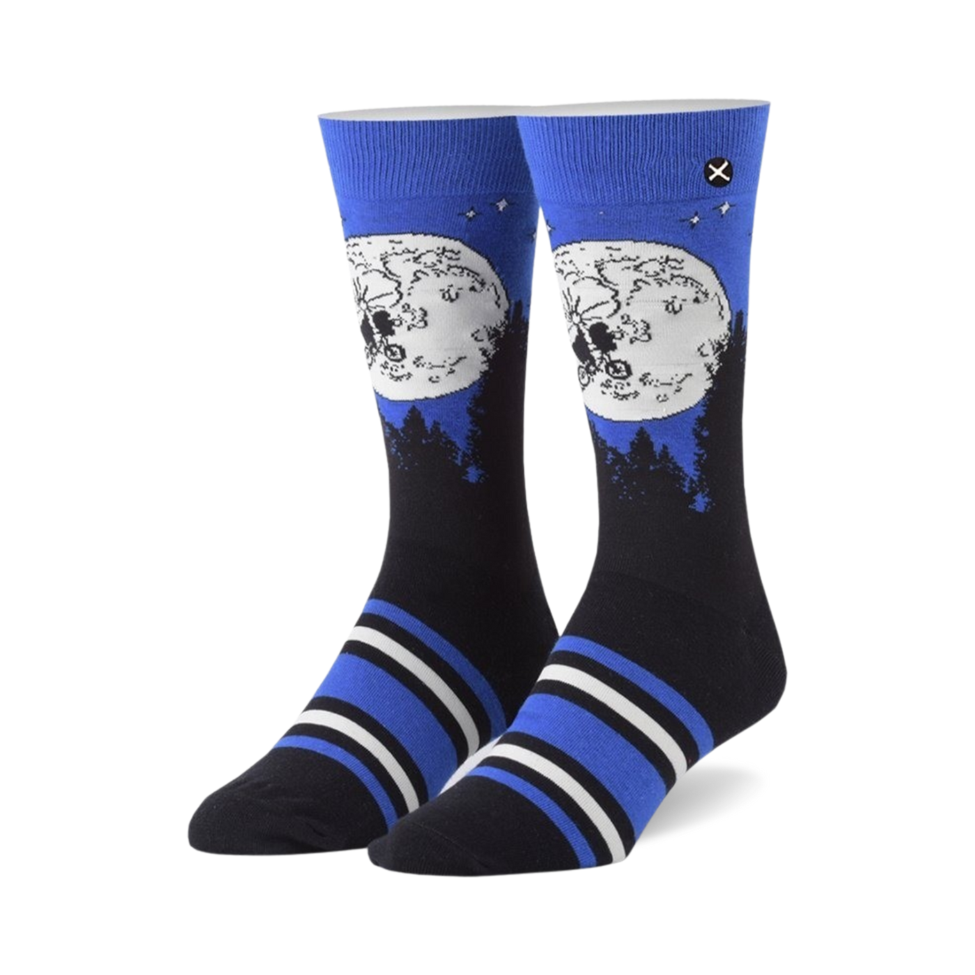 Pair of crew socks showcasing ET and Elliot silhouetted against a full moon on a dark blue background. Blue, black, and white stripes near the cuff.