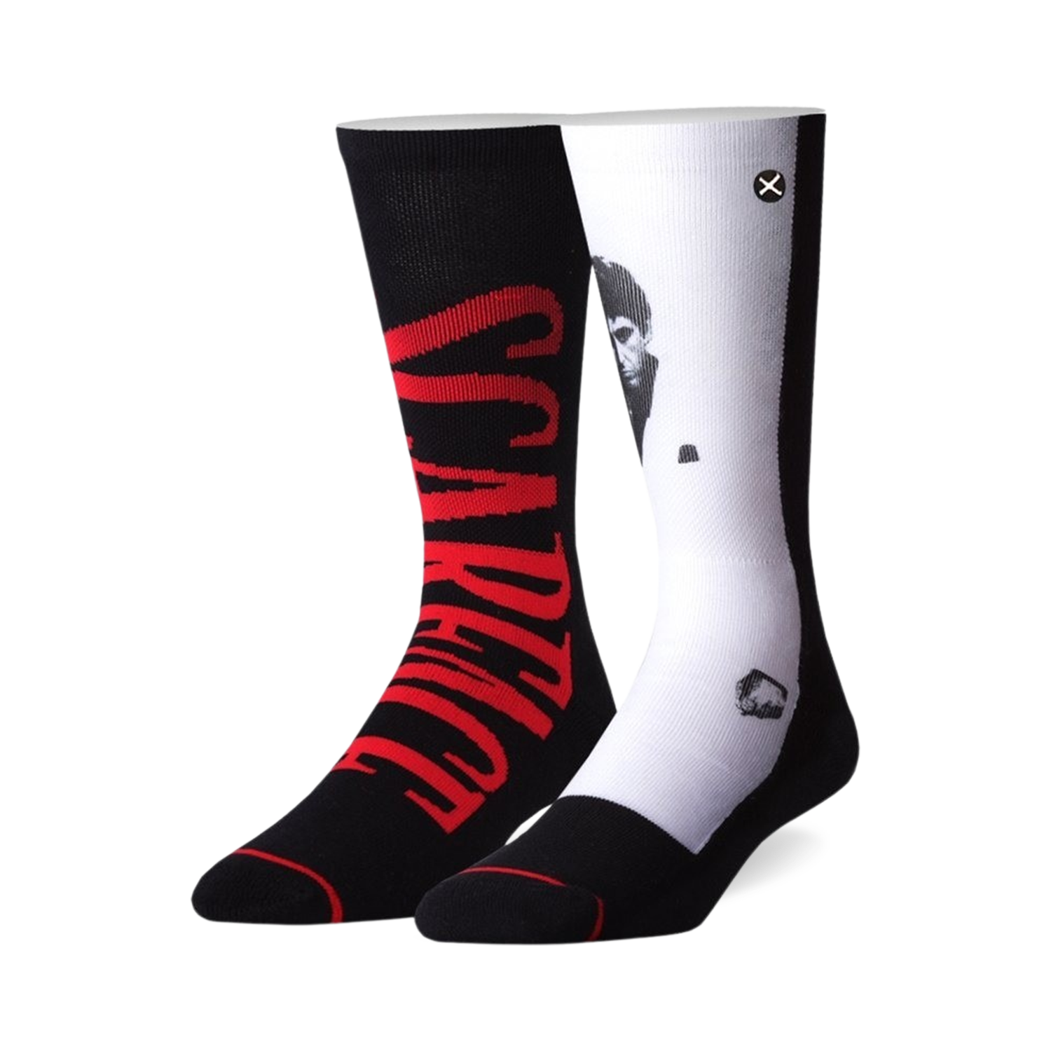 Pair of black and white crew socks. One sock features 'Scarface' in red, the other shows a black and white portrait of Al Pacino as Tony Montana.