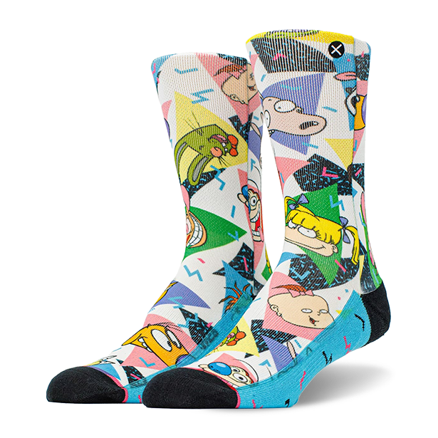 Pair of crew socks with a white base, featuring colorful 90s geometric patterns and Nickelodeon cartoon characters like Ren, Stimpy, and Rugrats. Black toes and blue heels.