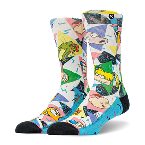 Pair of crew socks with a white base, featuring colorful 90s geometric patterns and Nickelodeon cartoon characters like Ren, Stimpy, and Rugrats. Black toes and blue heels.