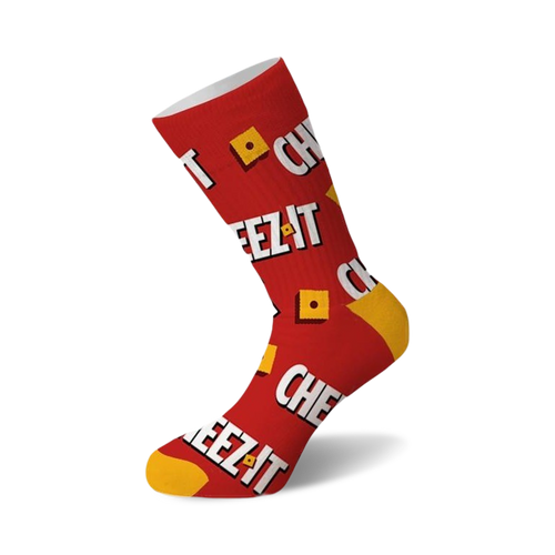 A single red crew sock with a "CHEEZ IT" text pattern and yellow cheese cracker squares. Yellow toe and heel.