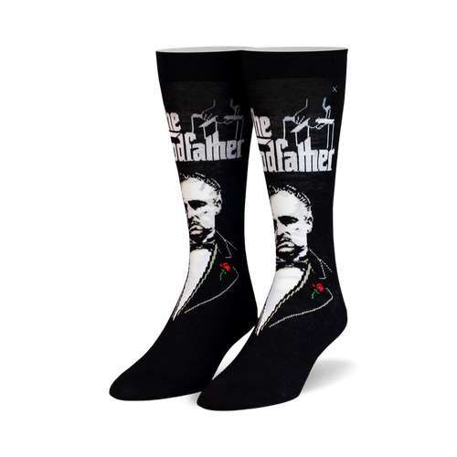 Pair of black crew socks featuring a grayscale portrait of Marlon Brando as Don Vito Corleone from The Godfather, along with the film title and a small red rose.