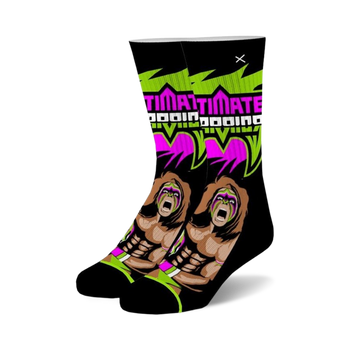 black crew socks feature ultimate warrior, pro wrestler, with face paint and long hair. sock also has words "ultimate warrior" on it. perfect for men and women who love wrestling.  