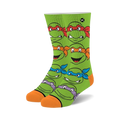 Teenage Mutant Ninja Turtles crew socks. Green background with orange and different colored masks.  Features all four turtle's faces.